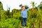 Young boy with carrot enjoying life in countryside