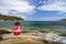 Young boy in casual relaxing sitting on summer sea