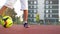 Young boy with caucasian appearance kicks soccer ball outdoors. He has a lot of fun playing football.