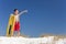 Young Boy Child on A Beach with Surfboard Pointing