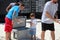 Young boy choosing mullet fish to throw in competition, Flora-Bama, Gulf Coast, Florida and Alabama, 2018