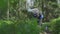 Young boy collecting Wild blueberries into aluminium can