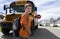 Young boy crossing in front of yellow school bus