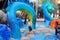 A young boy dances on the stones at a waterpark