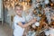 Young boy decorating Christmas tree