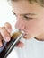 Young boy drinking soda