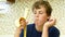 Young boy eating a banana with pleasure.