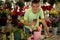 young boy florist works in a flower shop