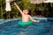 young boy in a floting tire enjoys fresh pool water