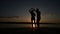 Young boy and girl dance salsa at sunset near the lake. Silhouette shooting. Slow motion