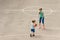 Young boy and girl playing basketball