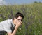 Young boy with glasses in the meadows with allergy