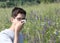 Young boy with glasses in the meadows with handkerchief