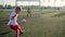 Young boy goalie in football uniform misses shot