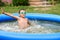 Young boy with goggles in swimming pool