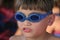 Young boy with goggles to swim