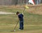 Young Boy with Golf Flag