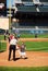 A young boy is greeted at home plate