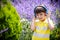 Young boy in headphones listening to modern music in nature. Child likes the song. Kid music relax concept after school classes