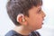 young boy with hearing aid