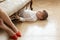 A young boy hides under the couch while his mom is going on a date