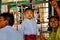 A young boy and his family in a temple at Shwedagon Pagoda in Yangon.