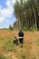 Young boy and his mom walking in the open meadow