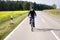 young boy on his mountain bike is on a bicycle tour along beautiful countryside