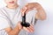 Young boy holding a black slime toy on his palm