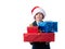 Young boy holding Christmas presents