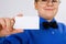 Young boy holding an empty advertising card