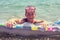 Young boy holding pool mattress in sea