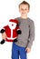 Young boy holding a stuffed santa smiling happily