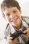 Young boy holding video game controller