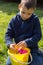 Young Boy Inspects His Easter Eggs after a Hunt