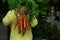 Young boy, kid child hands with homegrown harvest of carrots