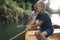 Young boy learn to paddling canoe