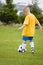 Young boy learning soccer