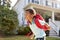 Young Boy Leaving House To Walk To School