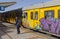 A young boy leaving a metro train at Kalk Bay station South Africa