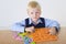 Young boy with letters jigsaw