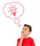 Young Boy looking up and thinking with light bulb in bubbles