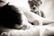 Young Boy Lying on Bed with Teddy Bear