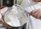 Young boy mixing flour with whisk