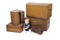 Young boy with old suitcases and boxes