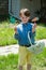 Young Boy Outside Dressed Up for Easter holding Basket