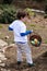 Young Boy Outside Dressed Up for Easter holding Basket