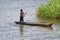 Young boy paddling a dugout in Lake Malawi