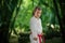 Young boy performs karate kata in the tranquil bamboo forest