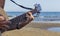 Young boy playing acoustic guitar on the beach